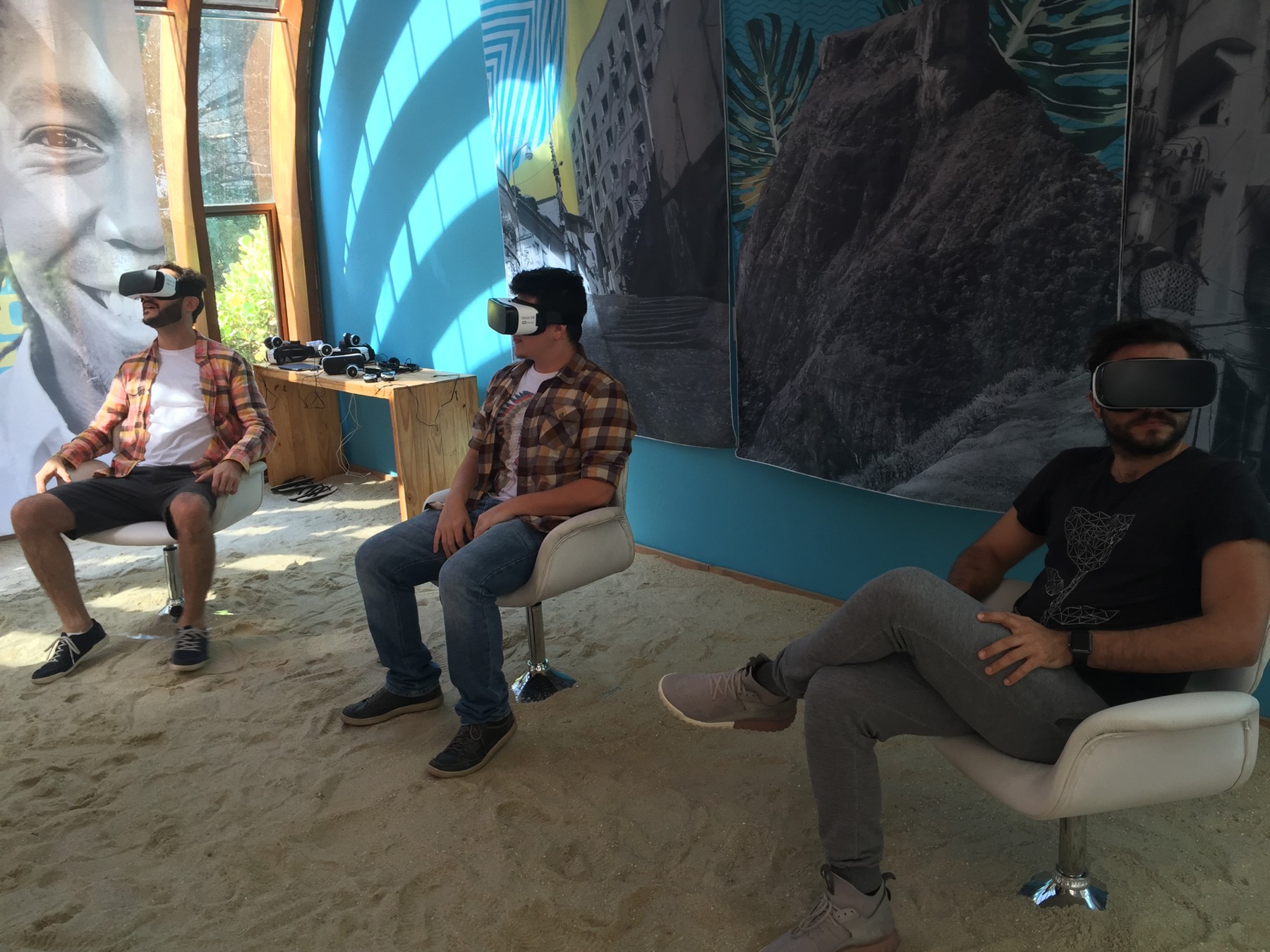 Three participants experience Soul Carioca with virtual reality headsets